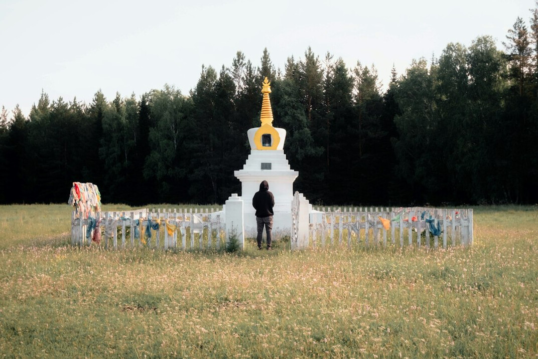 person meditating in nature