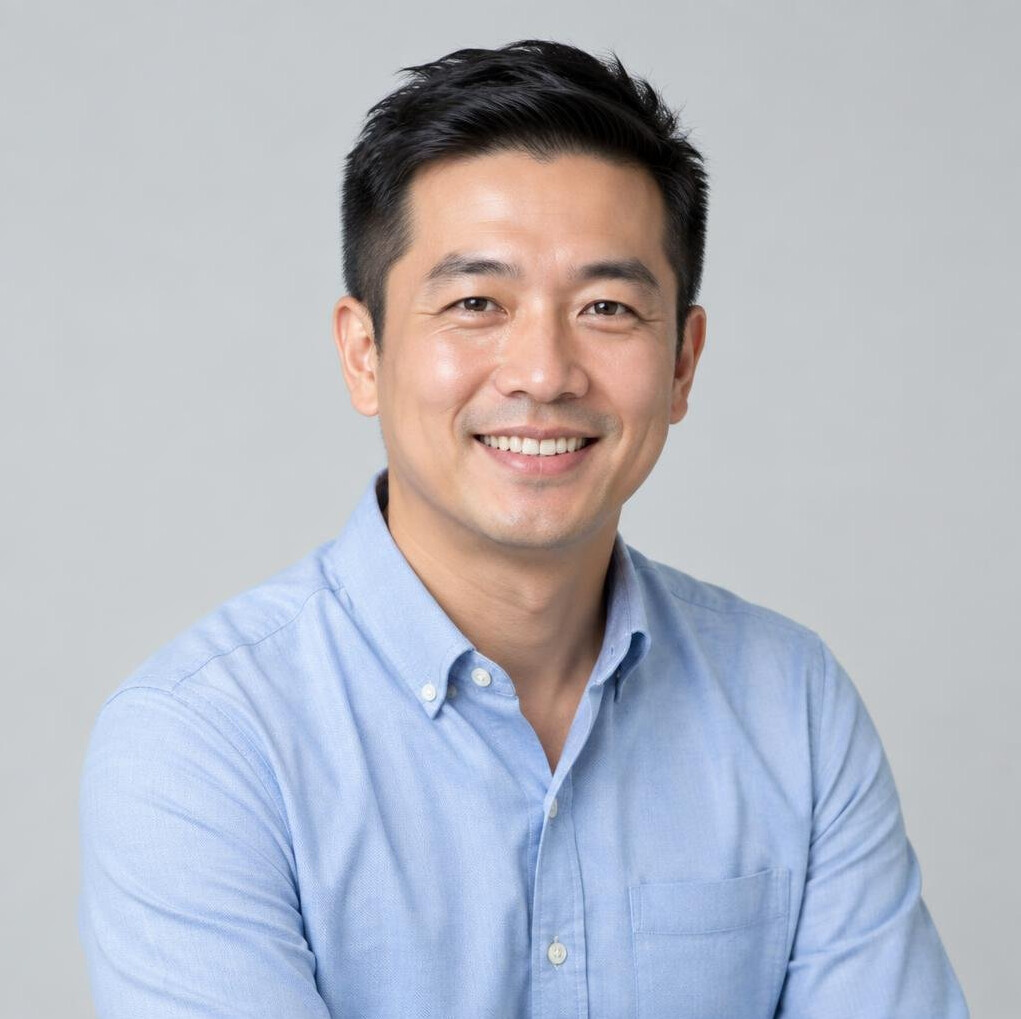 Studio portrait of a Chinese Singaporean man in smart casual wear